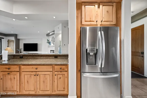 a bedroom with a large window and a balcony