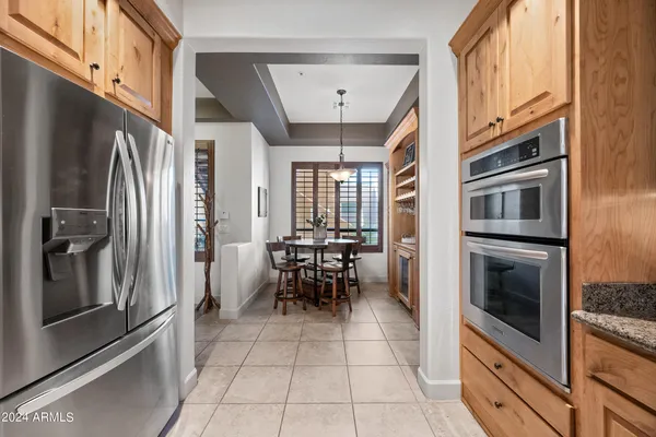 a view of a chairs and table in patio