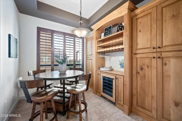 a view of a patio with a table and chairs