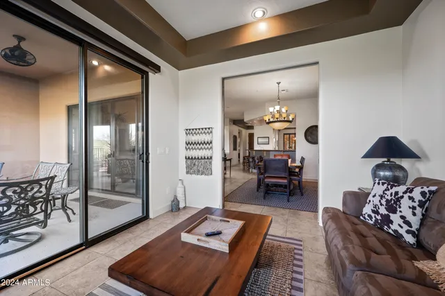 a bedroom with a bed and a mirror