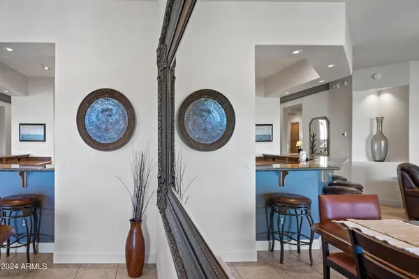 a large spacious bathroom with a double vanity sink a mirror a bathtub and a shower