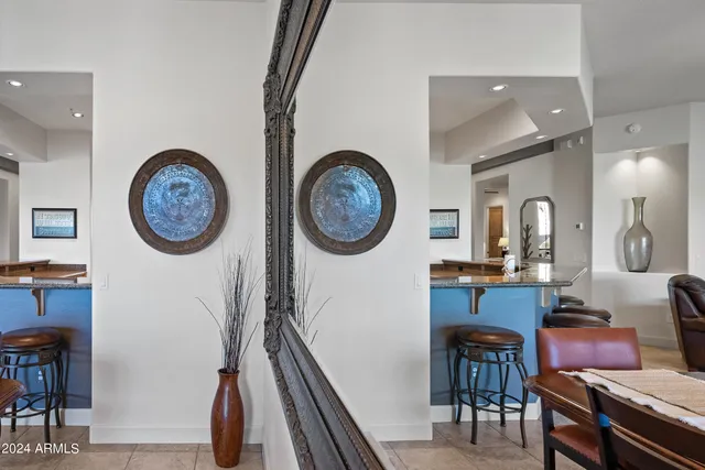 a large spacious bathroom with a double vanity sink a mirror a bathtub and a shower