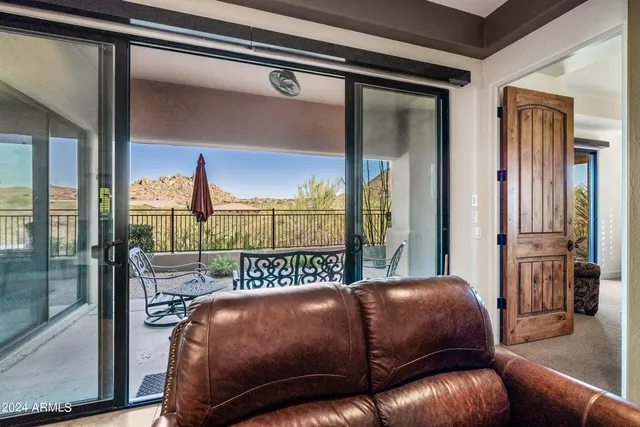 a bathroom with a granite countertop sink a mirror and shower