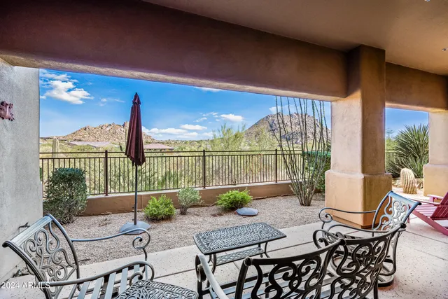 a bedroom with a bed and a mirror