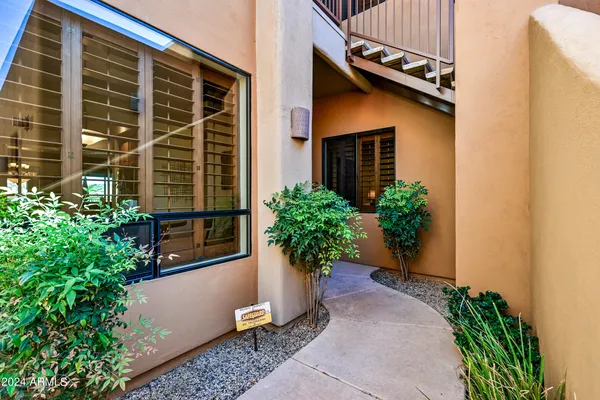 a view of a entryway with furniture and front door
