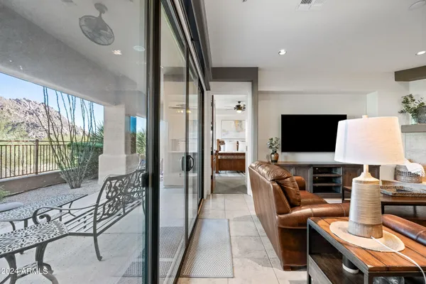 a bathroom with a granite countertop sink a mirror and shower