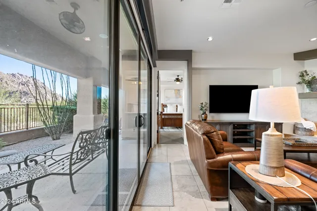 a bathroom with a granite countertop sink a mirror and shower