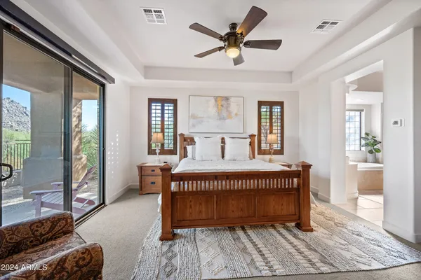 a bedroom with a bed and a walk in closet