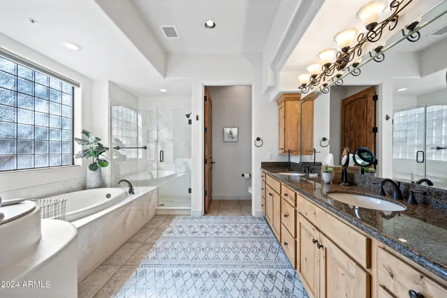 a view of a swimming pool with a table and chairs