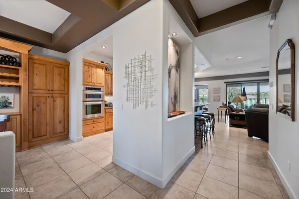 a lobby with furniture and floor to ceiling window