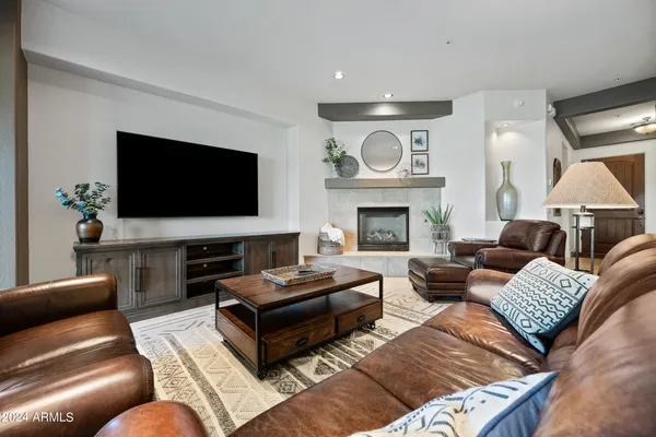 a kitchen with sink a stove and chairs