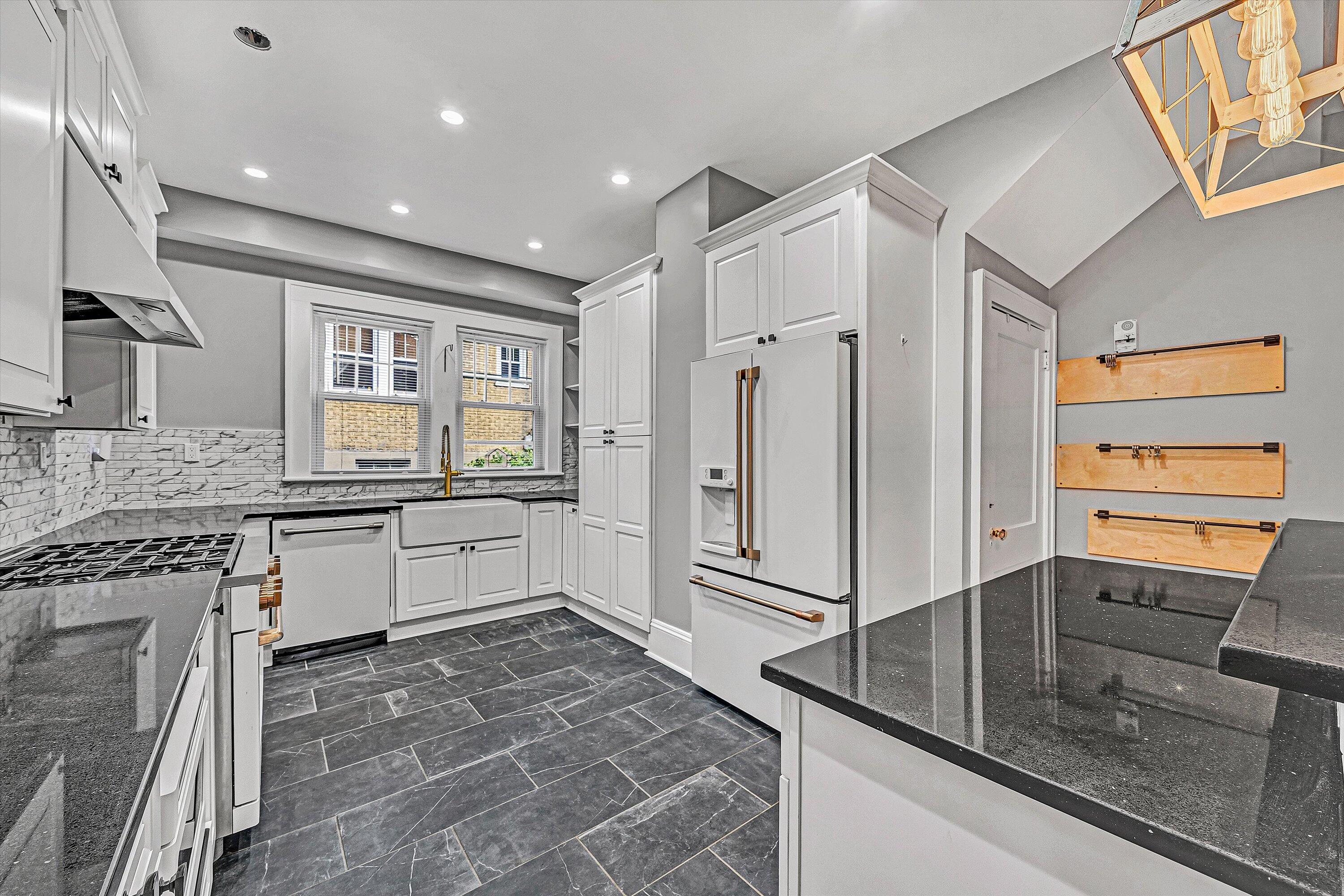 1725 Arlington Road Southwest Roanoke, VA 24015 - Photo 12 of 44 a kitchen with stainless steel appliances granite countertop a refrigerator and a sink