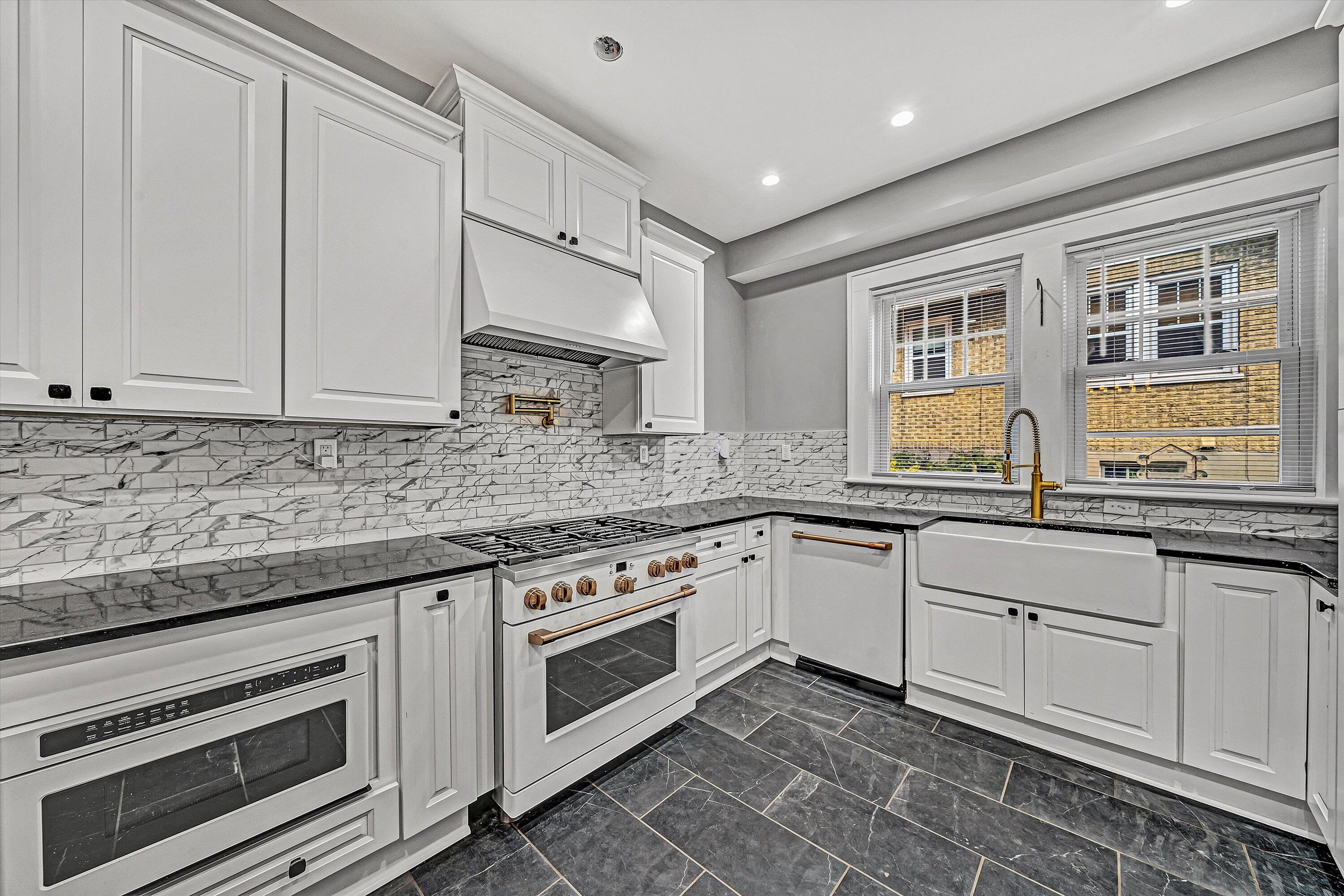 1725 Arlington Road Southwest Roanoke, VA 24015 - Photo 13 of 44 a kitchen with granite countertop white cabinets and white appliances