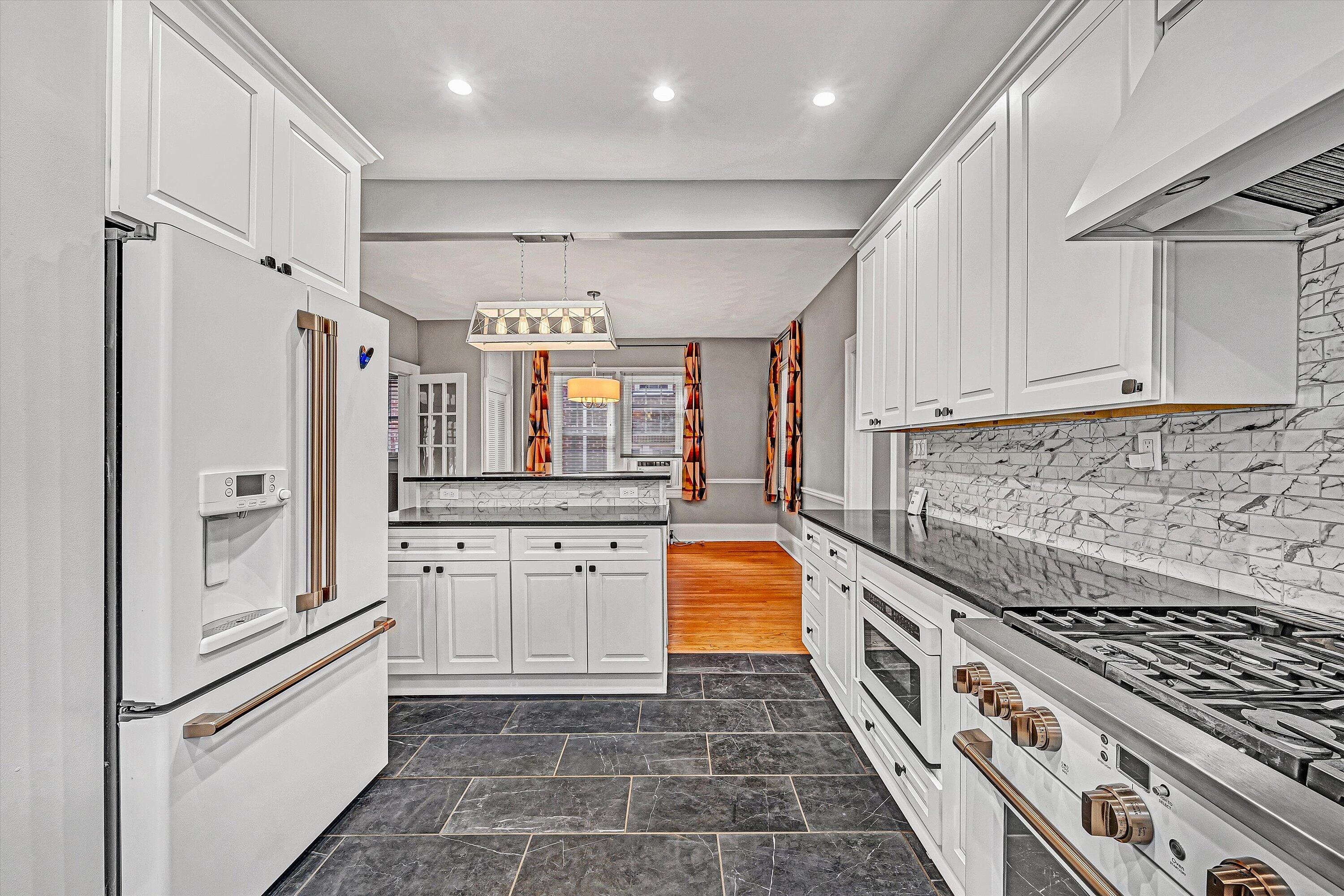 1725 Arlington Road Southwest Roanoke, VA 24015 - Photo 15 of 44 a kitchen with stainless steel appliances granite countertop a refrigerator and a stove