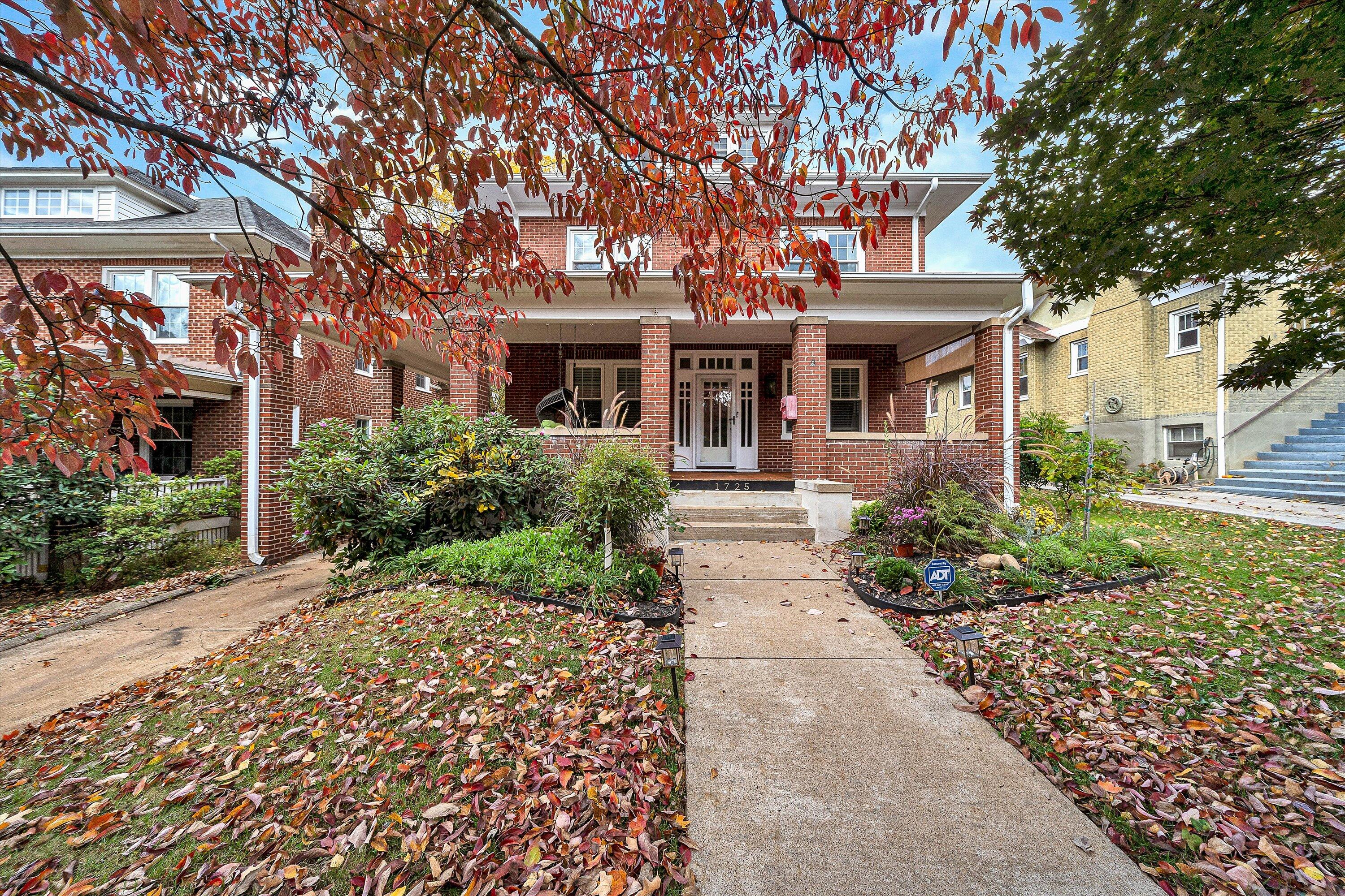 1725 Arlington Road Southwest Roanoke, VA 24015 - Photo 2 of 44 a front view of a house with a garden