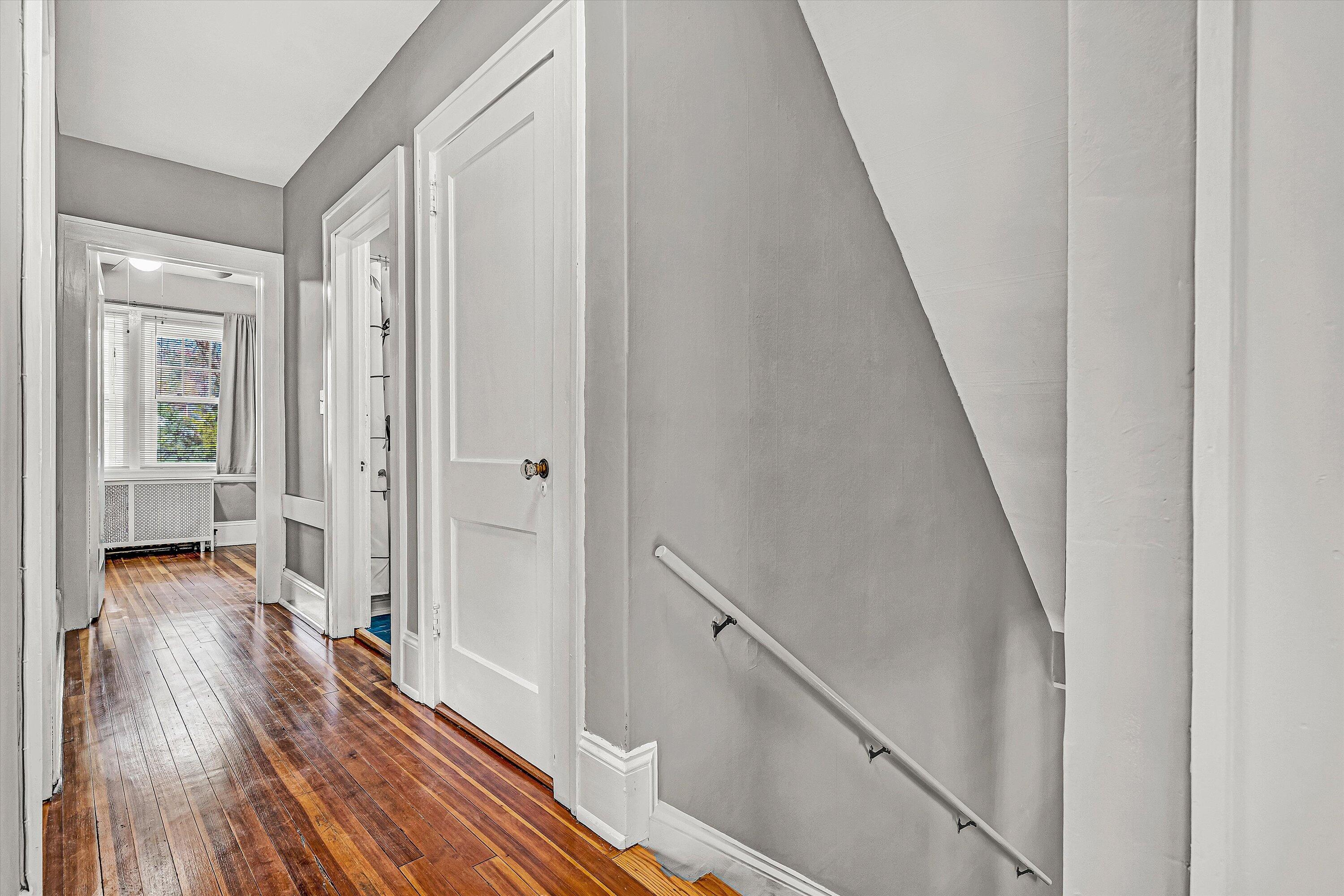 1725 Arlington Road Southwest Roanoke, VA 24015 - Photo 21 of 44 a view of a hallway with wooden floor and staircase