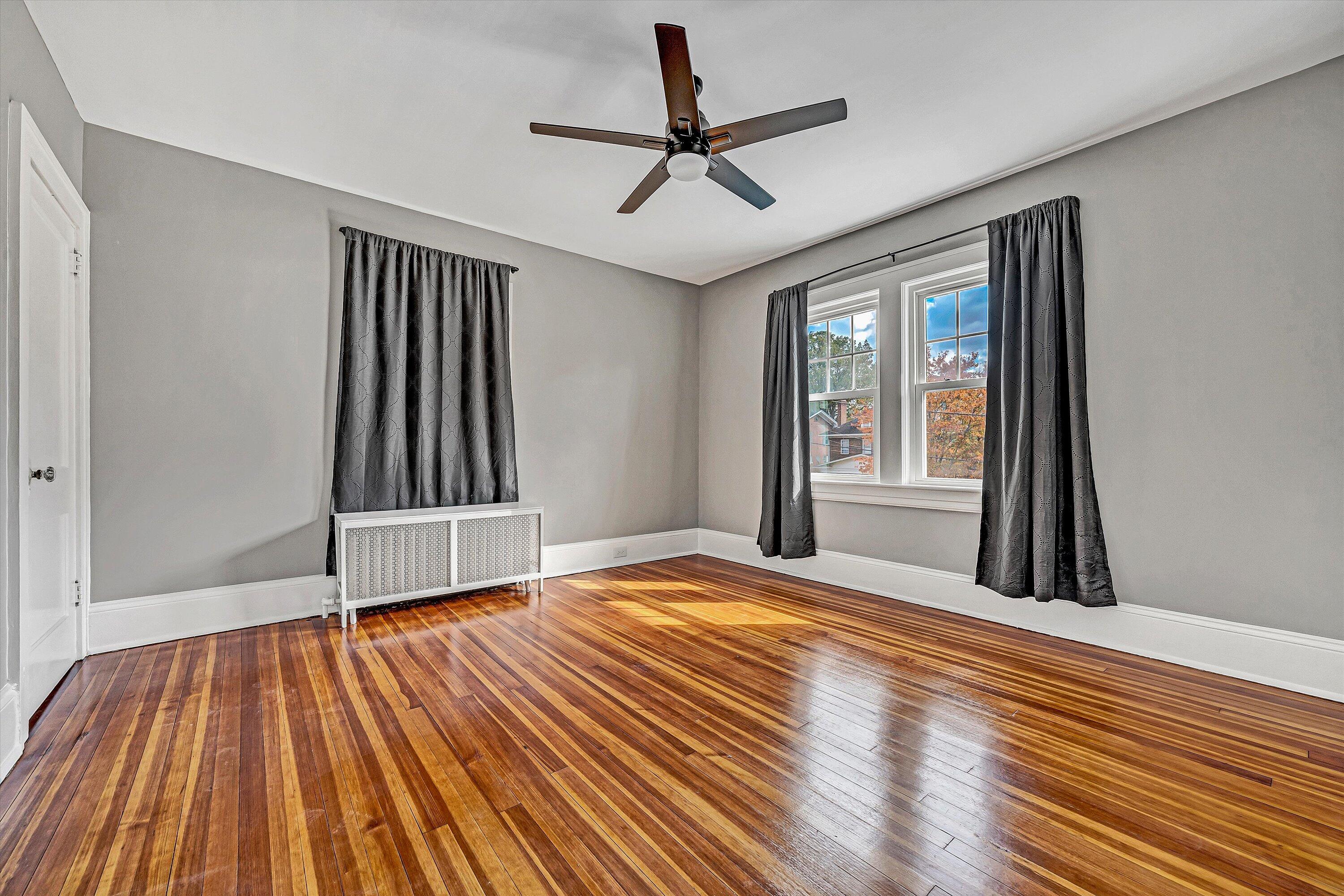 1725 Arlington Road Southwest Roanoke, VA 24015 - Photo 23 of 44 a view of empty room with wooden floor and fan
