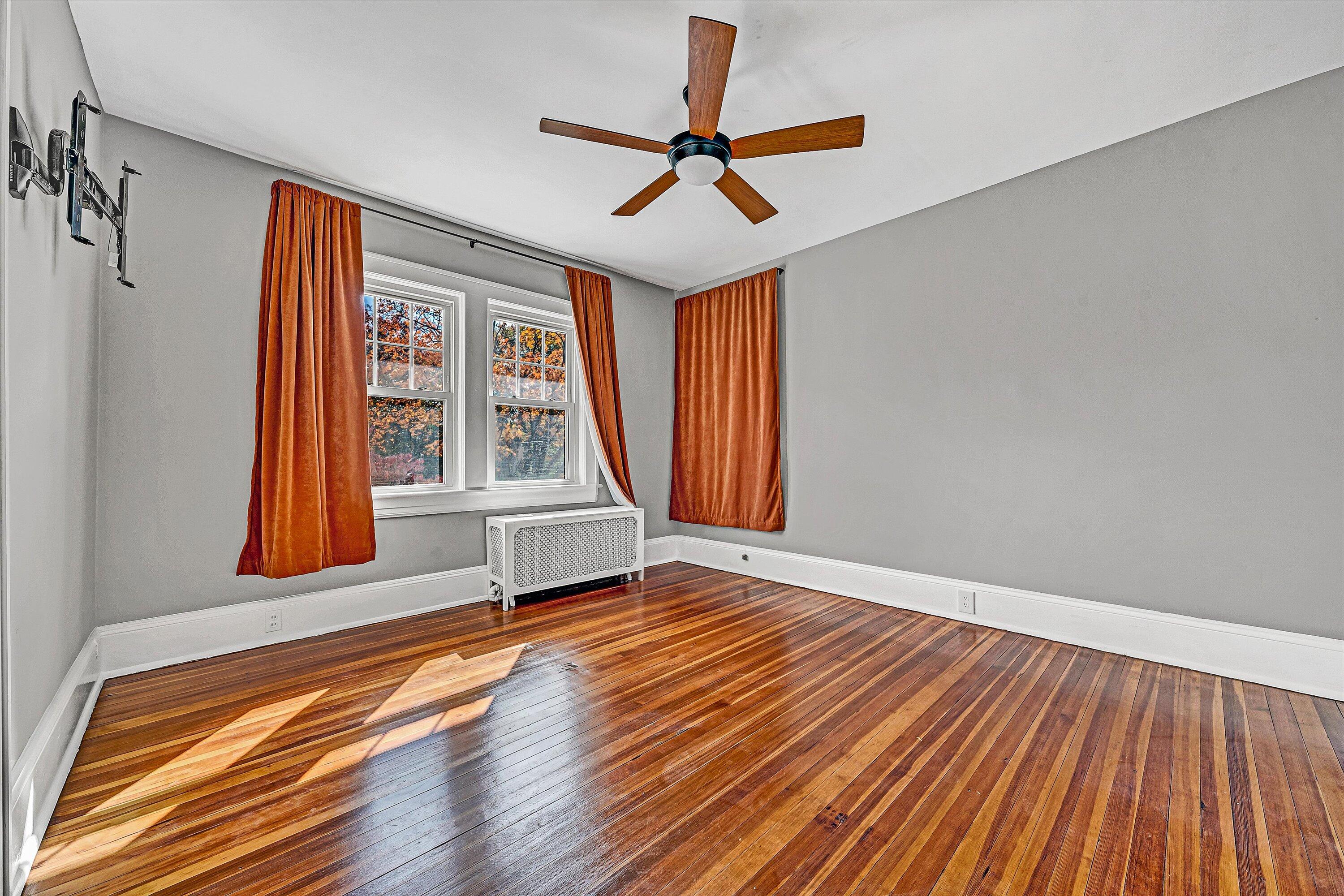 1725 Arlington Road Southwest Roanoke, VA 24015 - Photo 25 of 44 a view of an empty room with a window and wooden floor