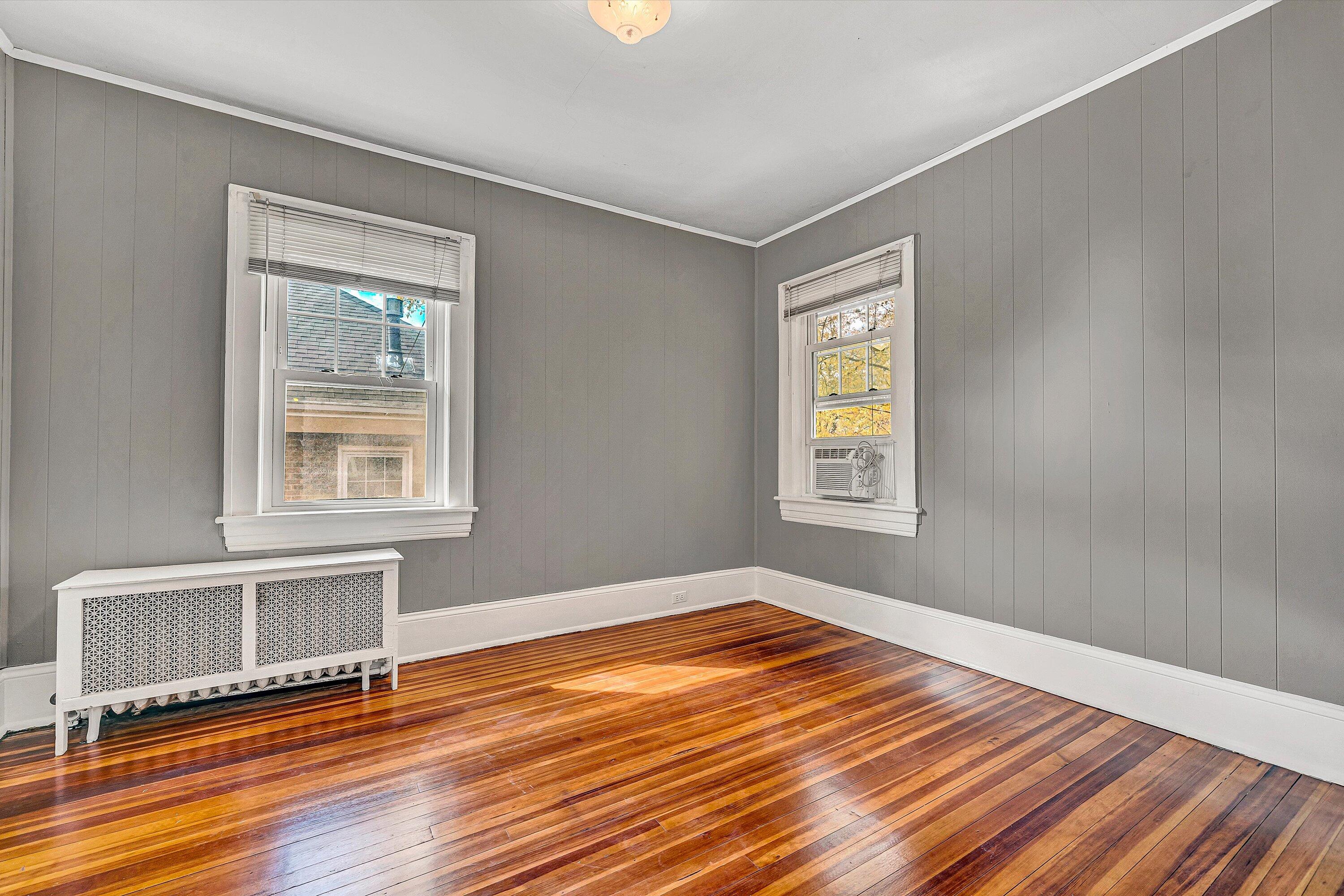 1725 Arlington Road Southwest Roanoke, VA 24015 - Photo 26 of 44 a view of an empty room with wooden floor and a window