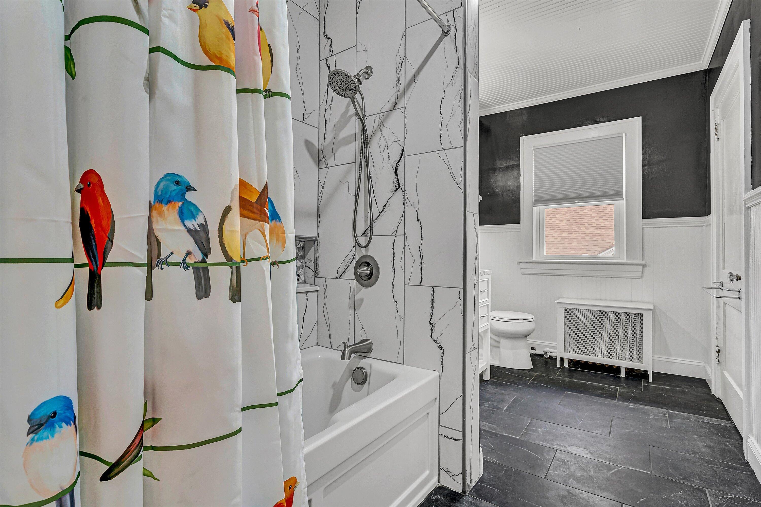 1725 Arlington Road Southwest Roanoke, VA 24015 - Photo 27 of 44 a bathroom with a sink mirror and tub