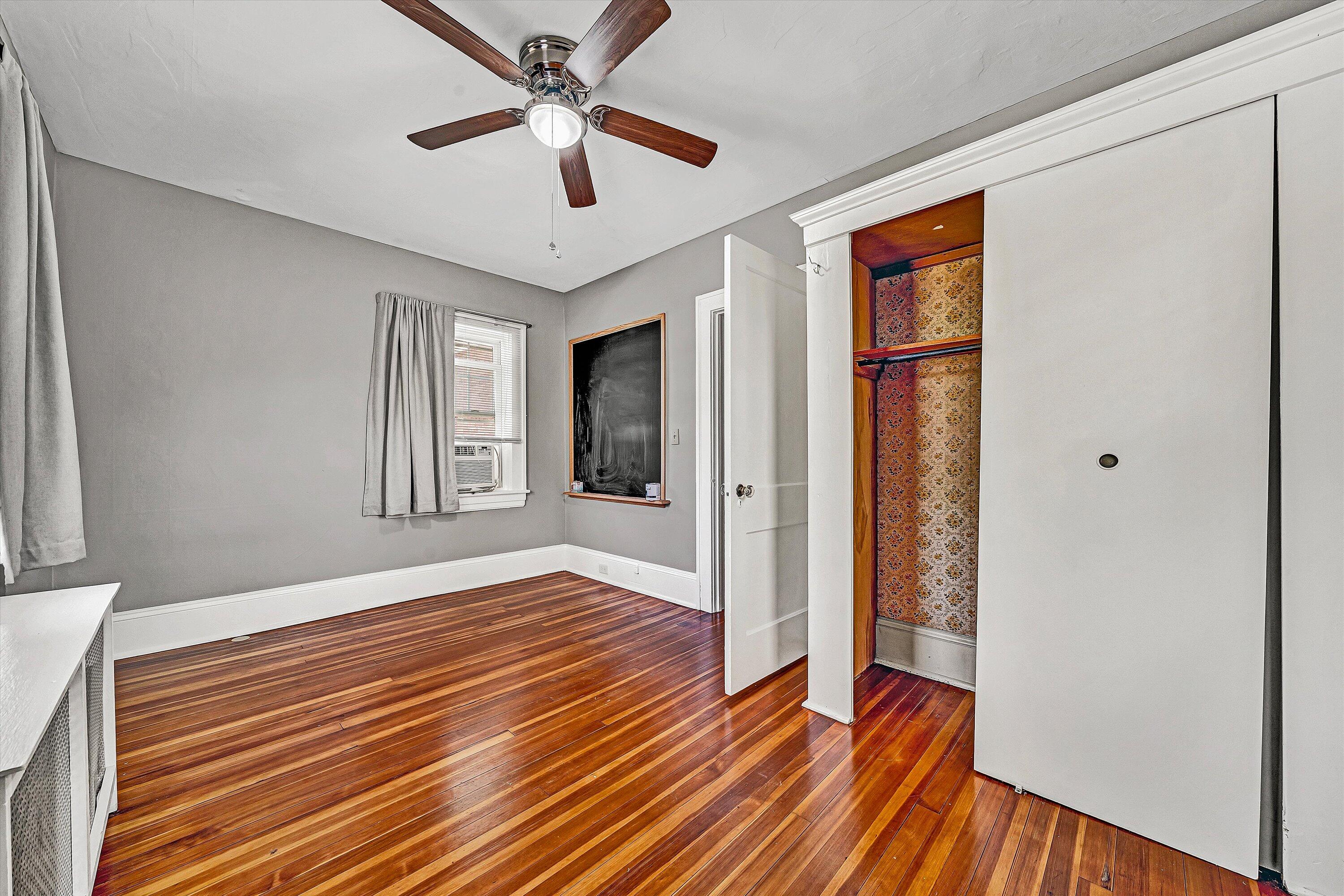 1725 Arlington Road Southwest Roanoke, VA 24015 - Photo 30 of 44 a view of an empty room with wooden floor and a window