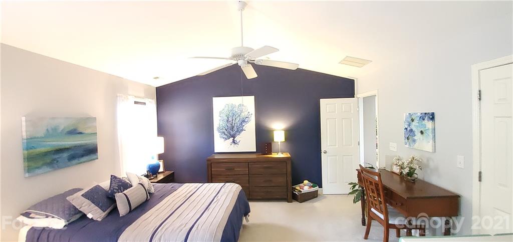 11647 Tucker Field Road Midland, NC 28107 - Photo 12 of 30 a bedroom with a bed and wooden floor
