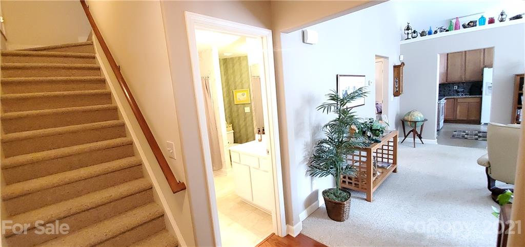 11647 Tucker Field Road Midland, NC 28107 - Photo 21 of 30 a view of an entryway with wooden floor and a potted plant