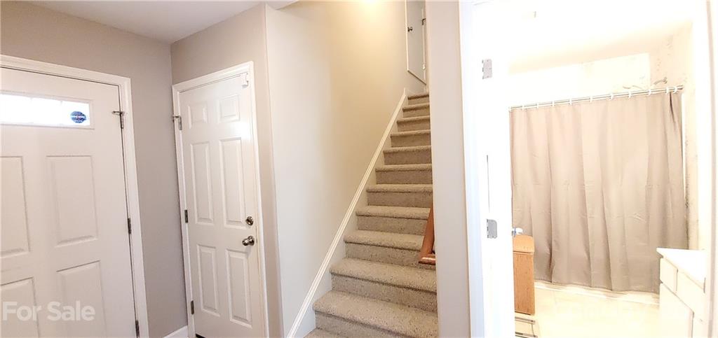 11647 Tucker Field Road Midland, NC 28107 - Photo 22 of 30 a view of a hallway with wooden floor and staircase
