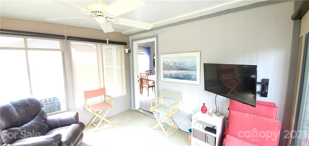 11647 Tucker Field Road Midland, NC 28107 - Photo 25 of 30 a living room with furniture and a flat screen tv