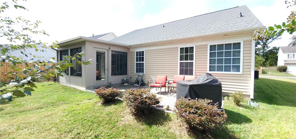 11647 Tucker Field Road Midland, NC 28107 - Photo 27 of 30 a front view of a house with a yard and patio