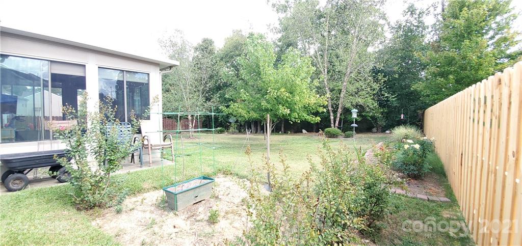 11647 Tucker Field Road Midland, NC 28107 - Photo 28 of 30 a view of backyard with a garden and plants