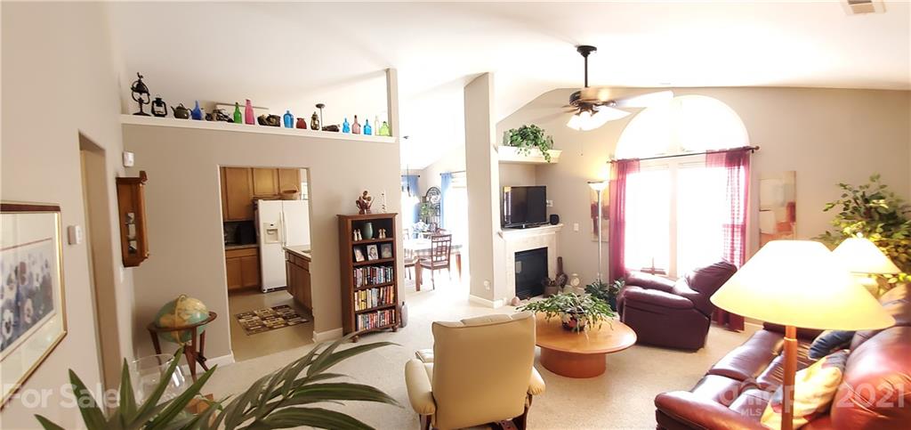 11647 Tucker Field Road Midland, NC 28107 - Photo 7 of 30 a living room with furniture and a chandelier