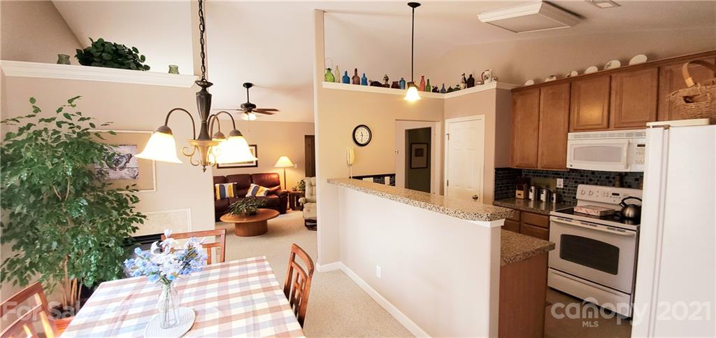11647 Tucker Field Road Midland, NC 28107 - Photo 10 of 30 a kitchen with a refrigerator and countertop