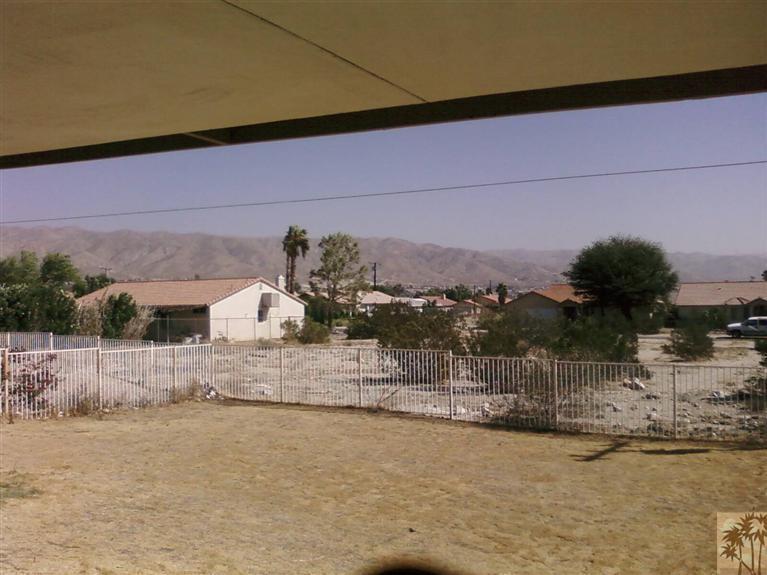 13700 El Rio Lane Desert Hot Springs, CA 92240 - Photo 9 of 9 a view of a house with a yard