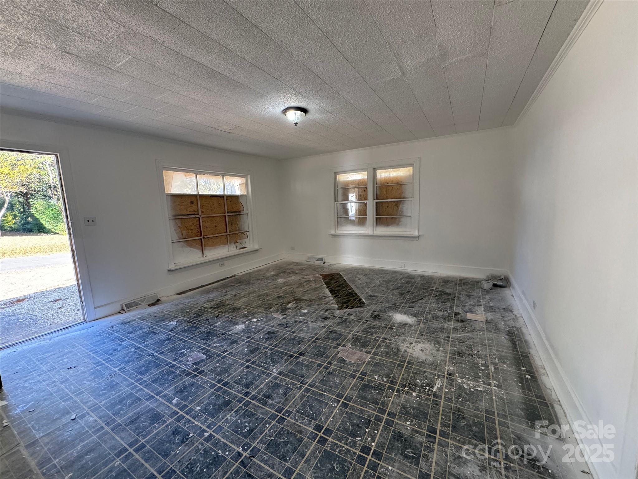 1224 Bailey Street Albemarle, NC 28001 - Photo 5 of 23 a view of empty room with windows