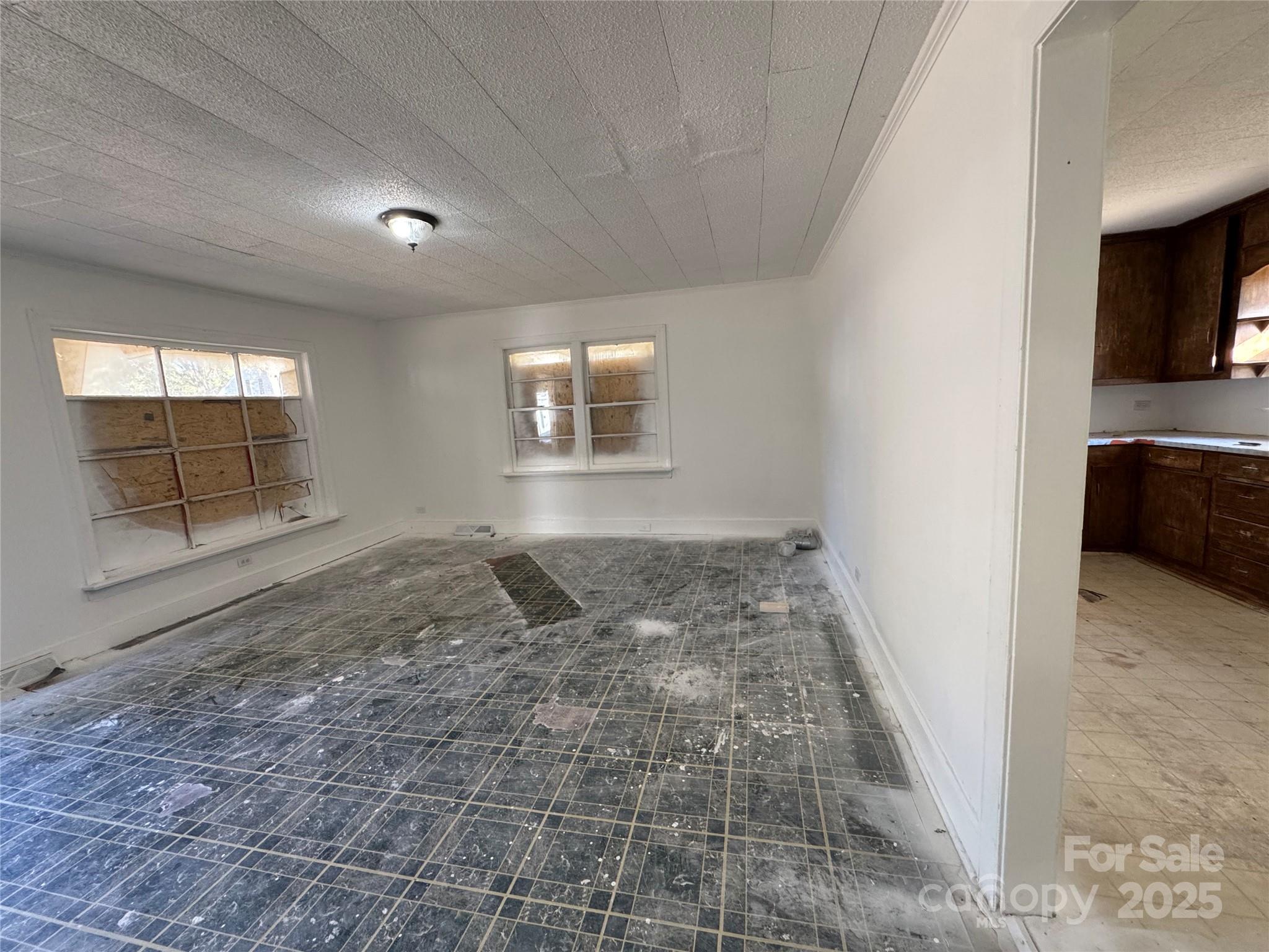 1224 Bailey Street Albemarle, NC 28001 - Photo 6 of 23 an empty room with windows