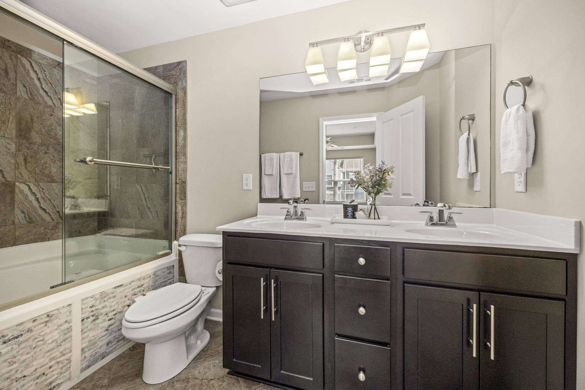 112 Bergen Drive Spring Hill, TN 37174 - Photo 26 of 37 a bathroom with a sink a toilet and shower
