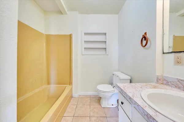a bathroom with a sink a toilet and a bathtub