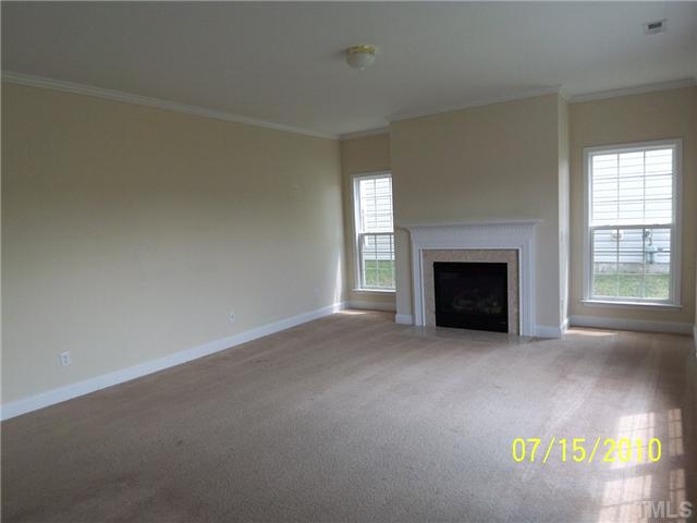 4345 Karlbrook Lane Raleigh, NC 27616 - Photo 4 of 12 a view of empty room with a fireplace