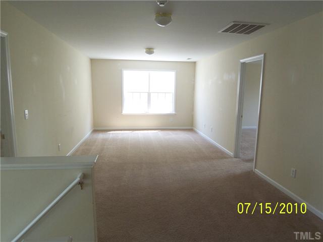 4345 Karlbrook Lane Raleigh, NC 27616 - Photo 5 of 12 a view of an empty room with a window