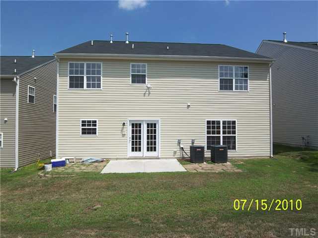 4345 Karlbrook Lane Raleigh, NC 27616 - Photo 10 of 12 a view of a house with a yard