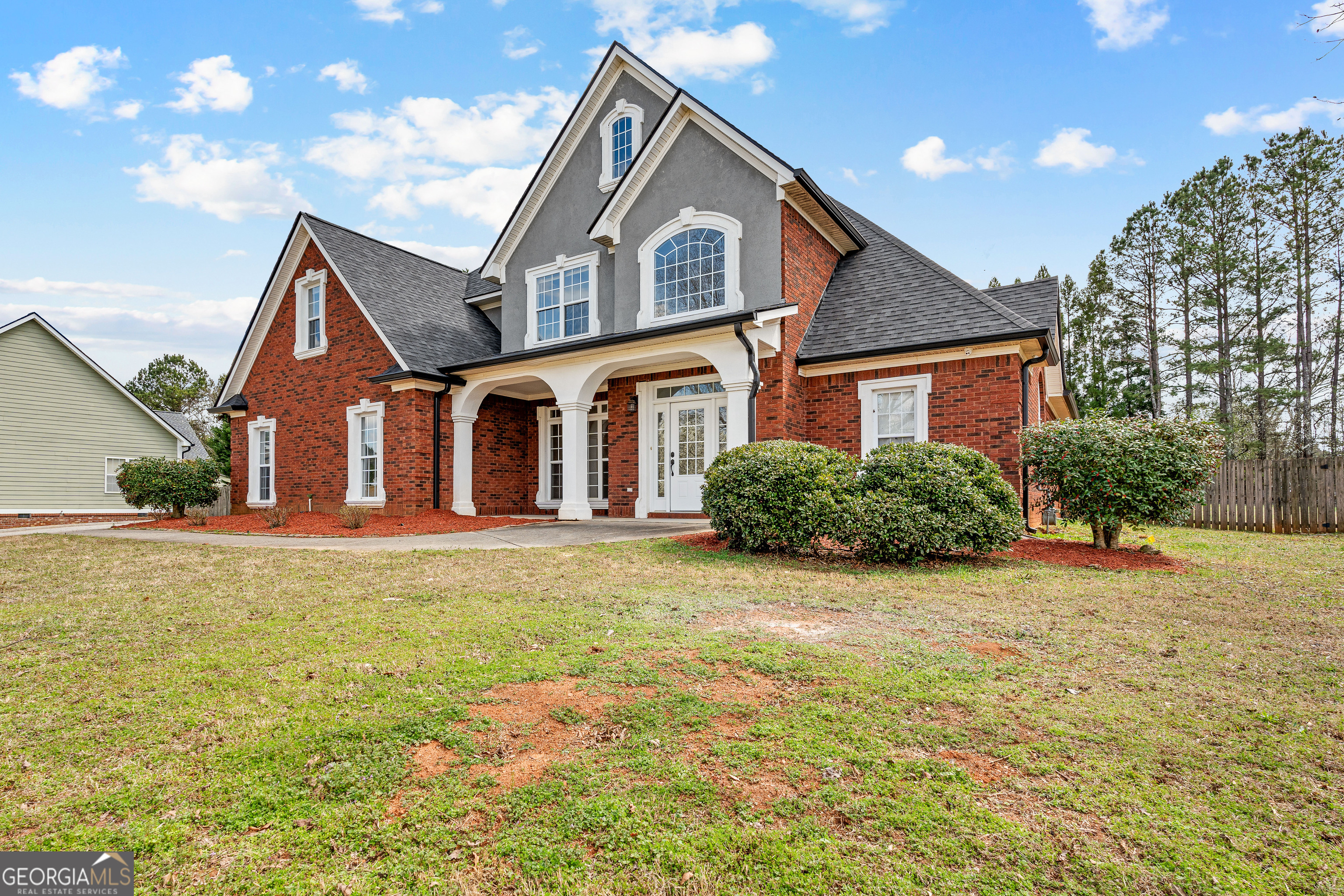 135 Arabian Tyrone, GA 30290 - Photo 1 of 1 a front view of a house with a yard