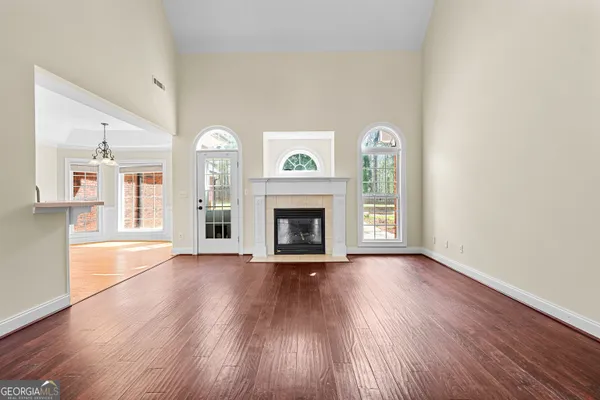 a view of an entryway with wooden floor