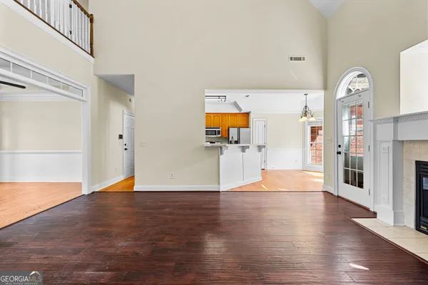 a kitchen with stainless steel appliances granite countertop a refrigerator and a sink