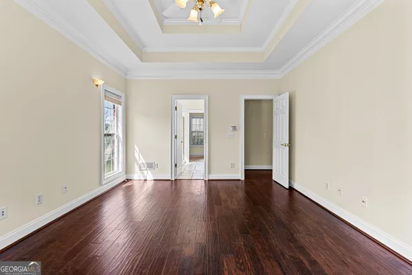 a bathroom with a bathtub and a window
