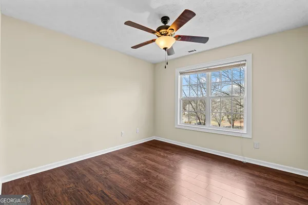 a bathroom with a double vanity sink and mirror with shower