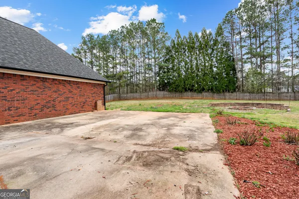 a house that has a tree in front of it