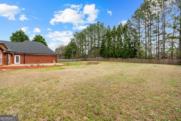 a house view with swimming pool in front of it