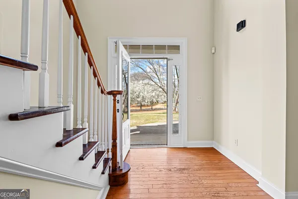 a view of entryway with wooden floor