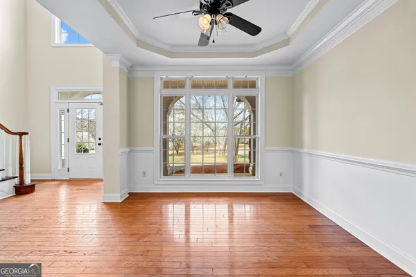 a view of livingroom with hardwood floor and ceiling fan